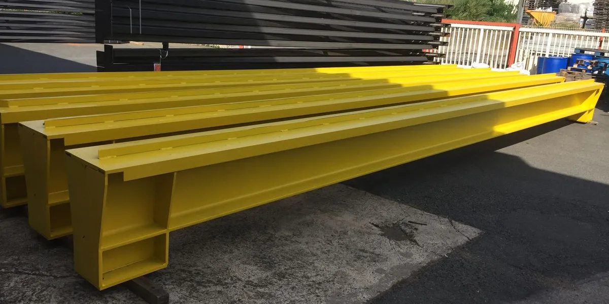 Finished painted structural steel beams after coating application