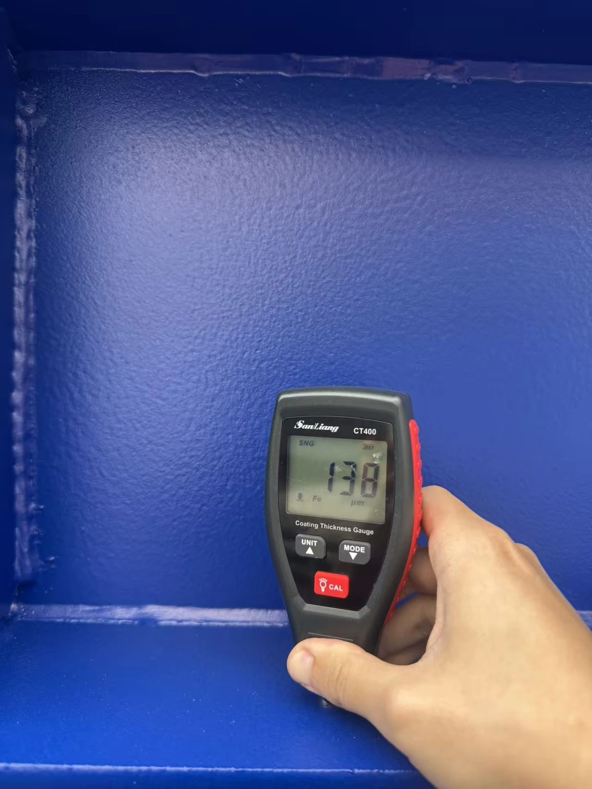 Coating thickness inspection showing 138 microns on a painted steel component