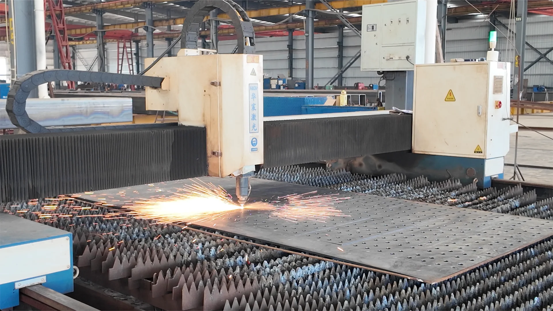 Laser cutting a steel plate for industrial factory building components