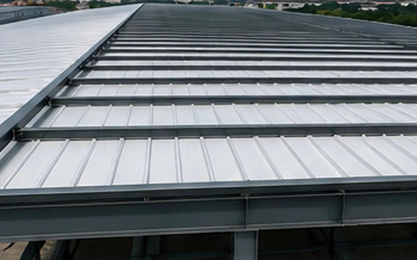 Secondary steel purlin roof support detail beneath sandwich panels